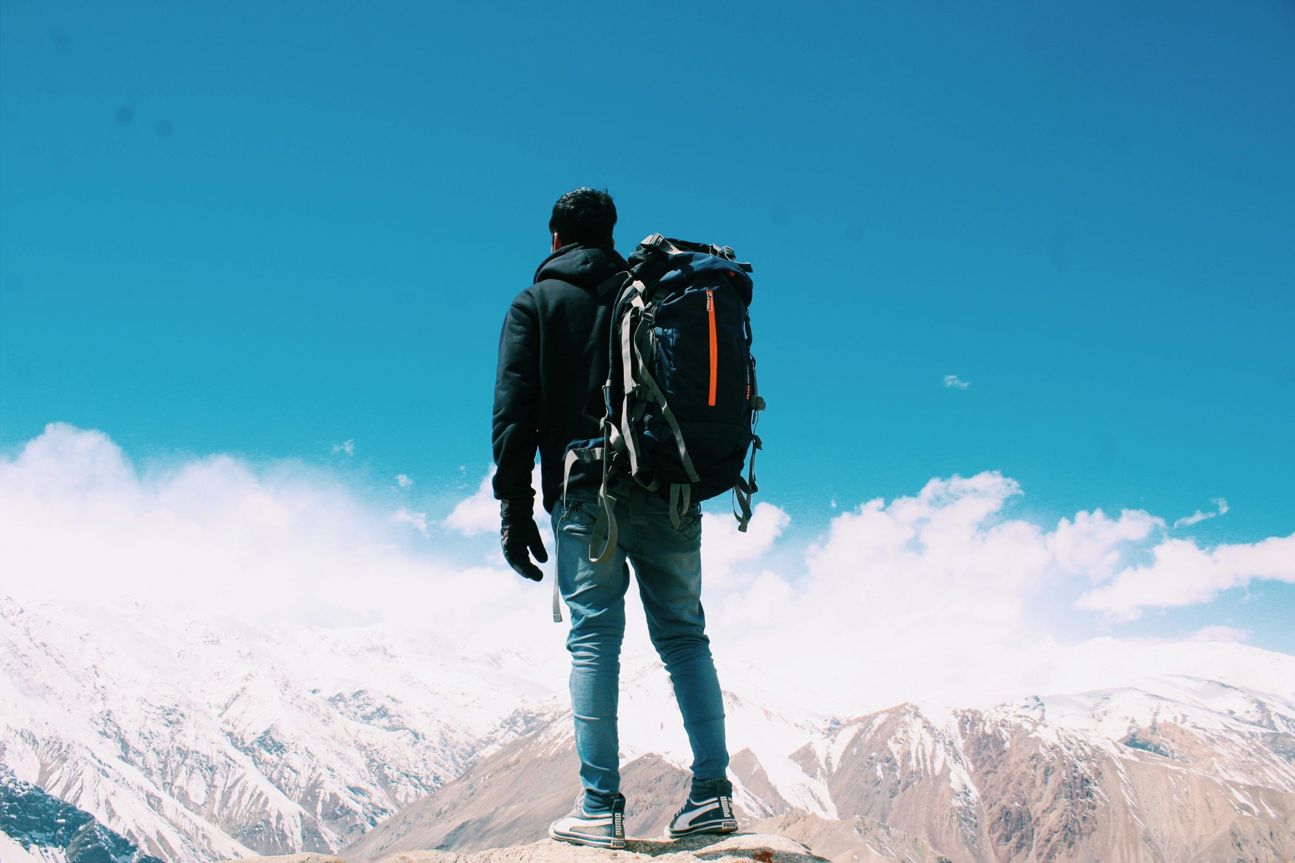 A traveler sitting in a hospital bed worried about medical expenses