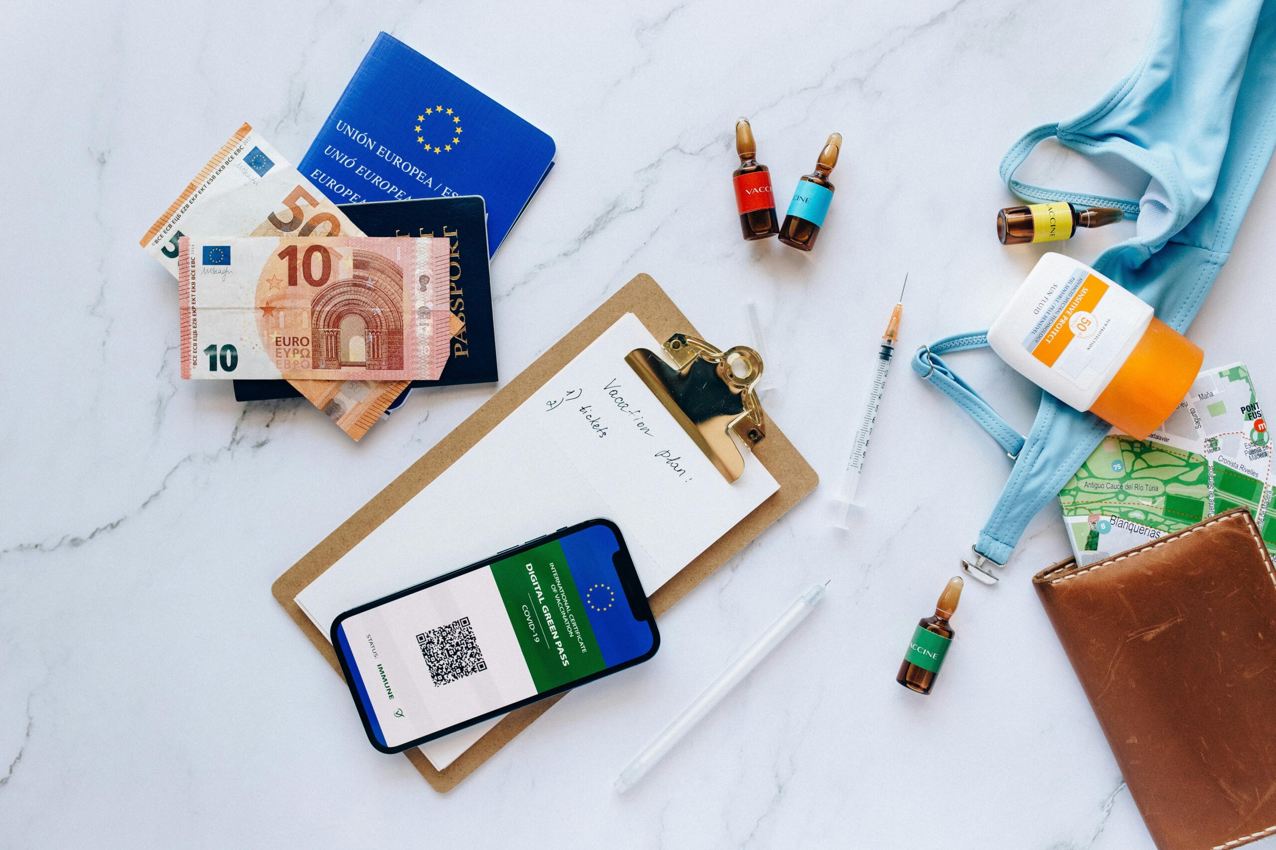 Checklist showing essential travel documents including passport, visas, and insurance papers