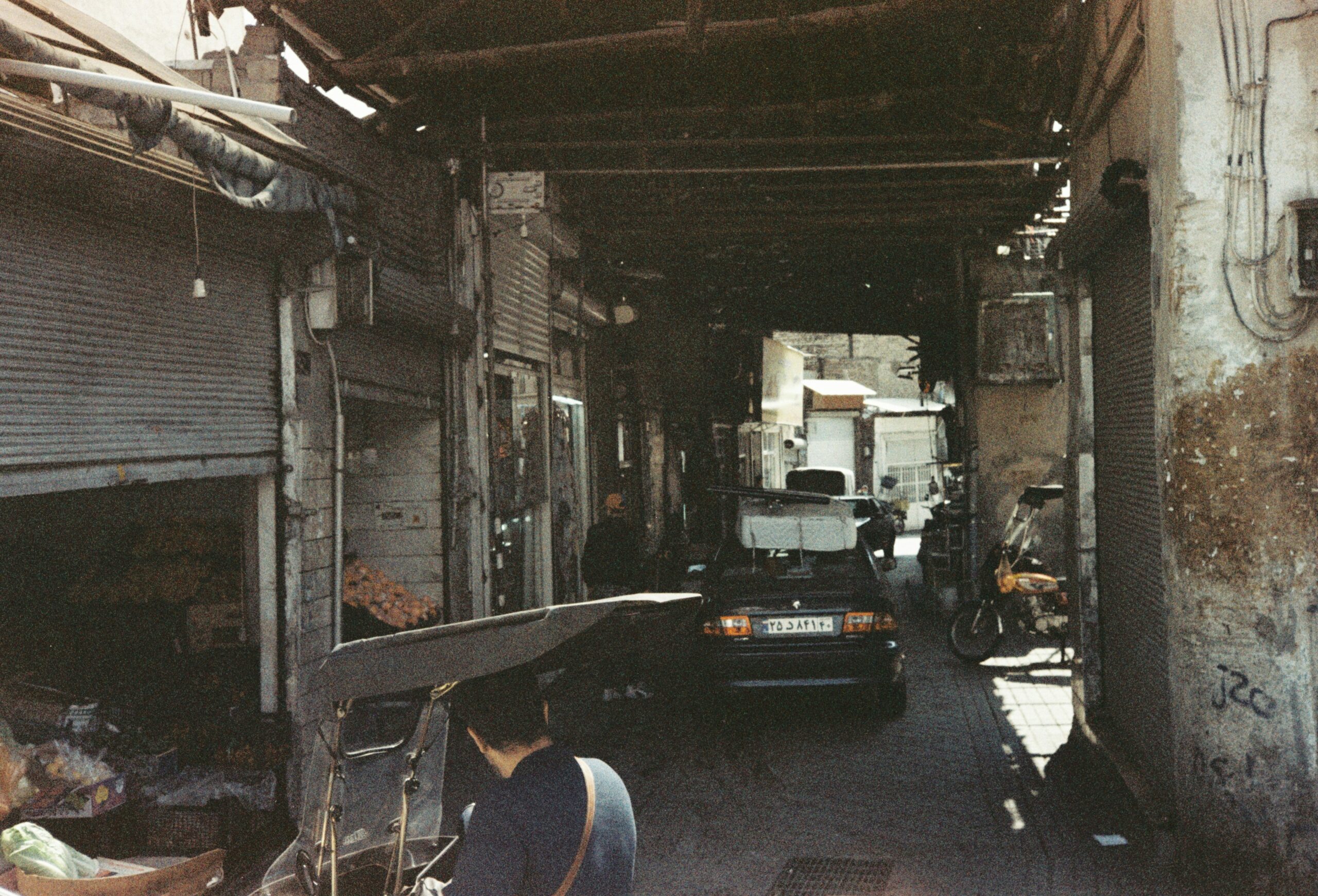 Photo of Sarah standing next to her repaired vehicle