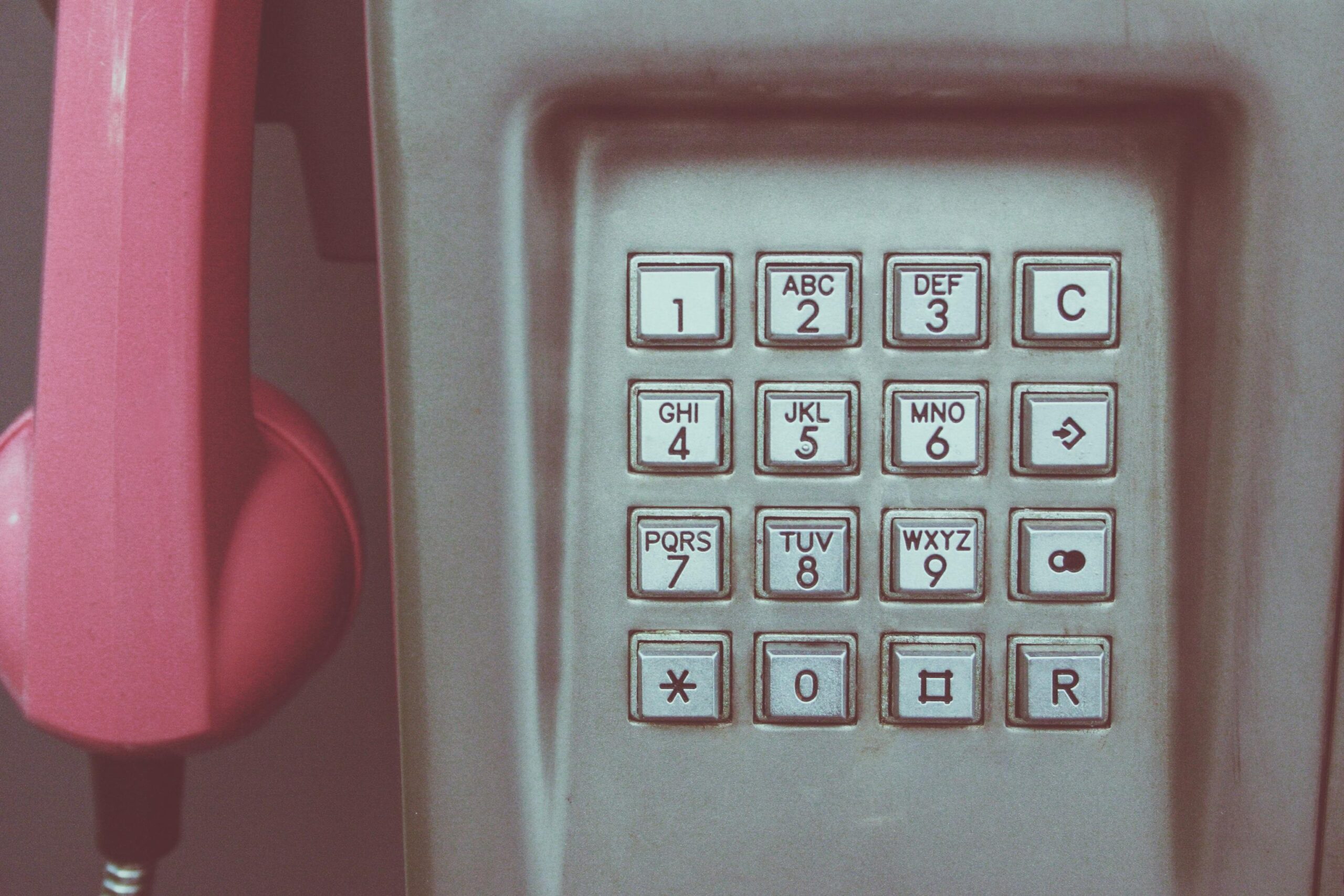 Screenshot of a template listing important contact numbers including travel insurance provider