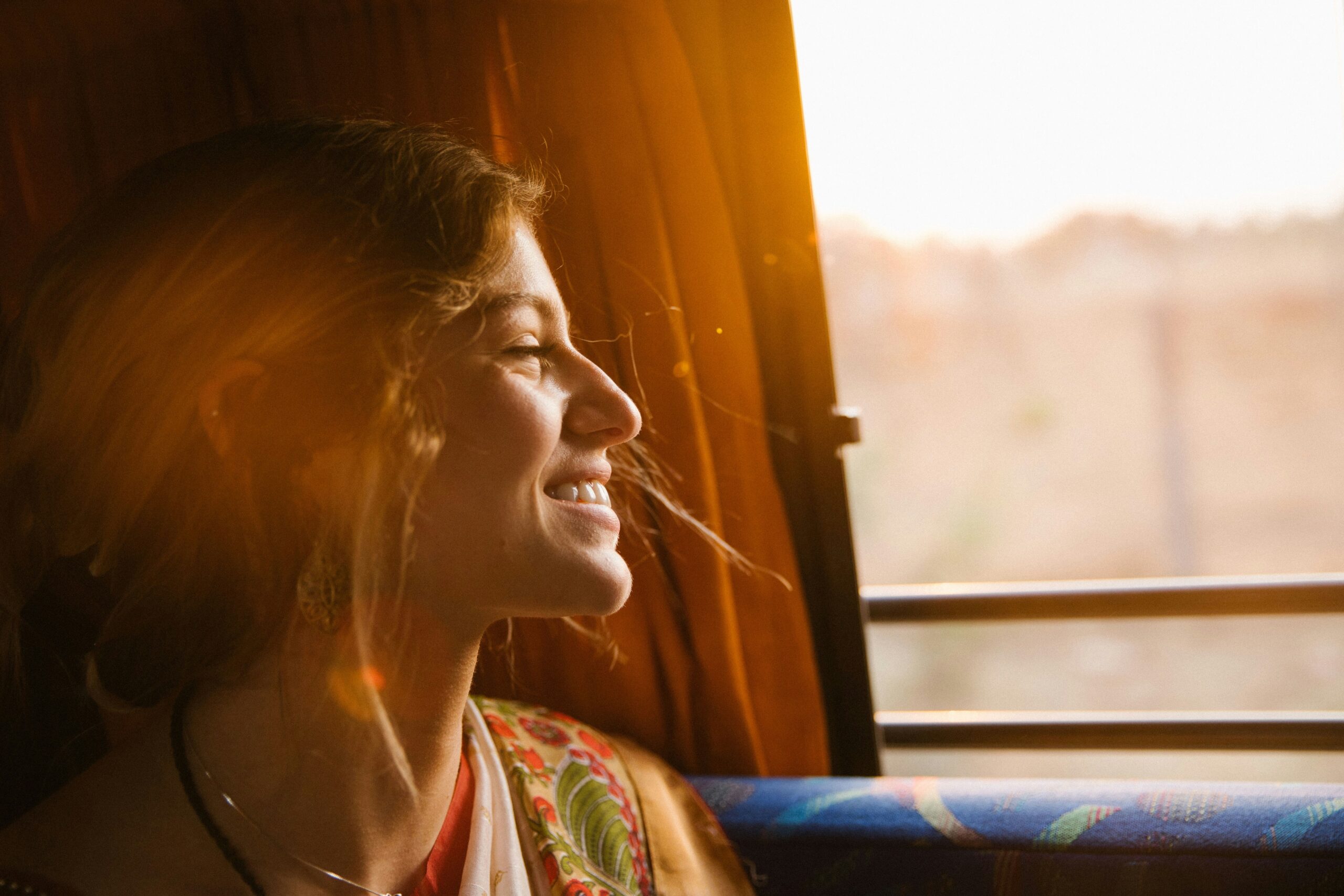 A relieved traveler smiling after successfully returning home thanks to effective crisis management support.