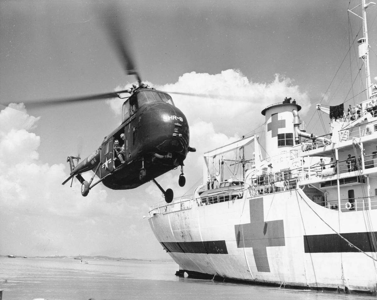 An air ambulance taking off at sunset, symbolizing repatriation readiness.