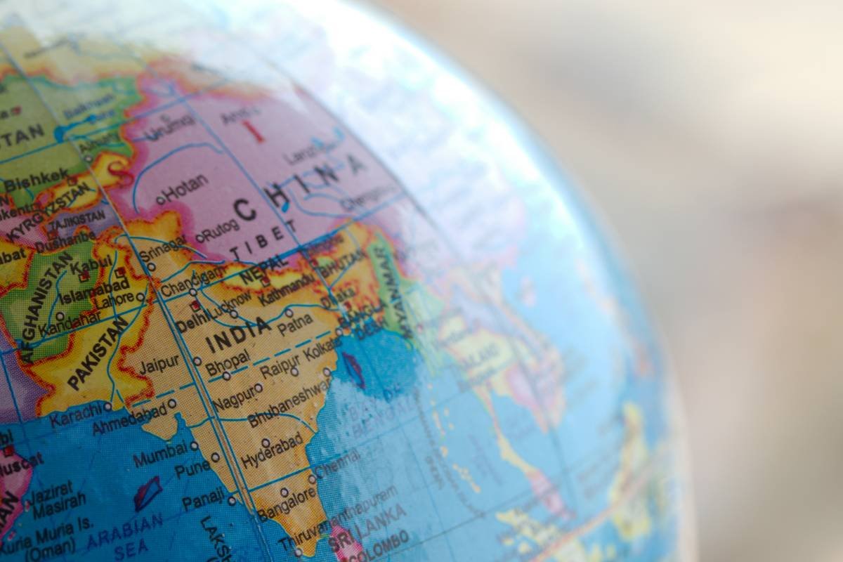 Bar chart comparing average repatriation costs by region: Europe ($220K), Asia ($180K), South America ($260K), Africa ($290K)
